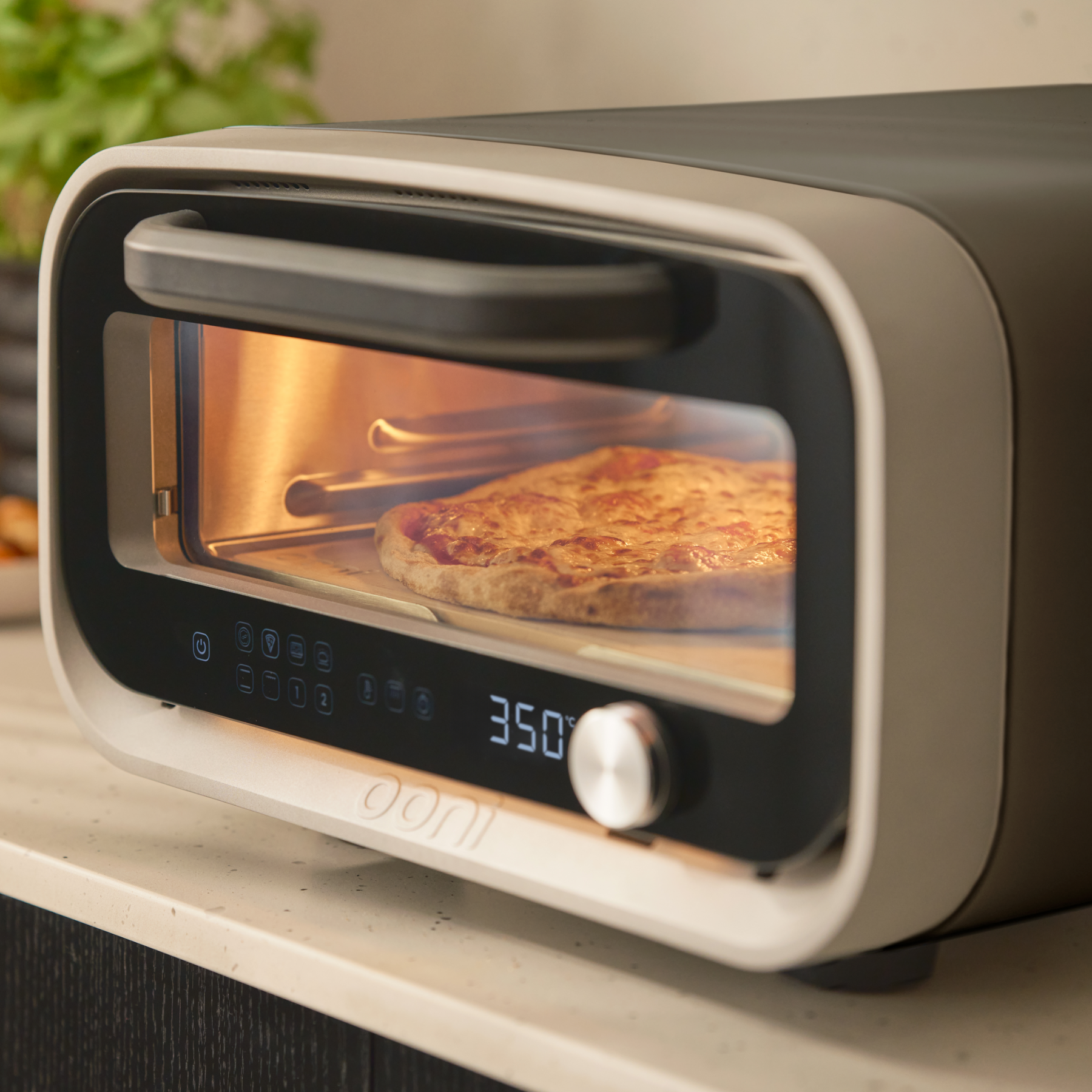 volt 2 electric pizza oven - pizza cooking inside