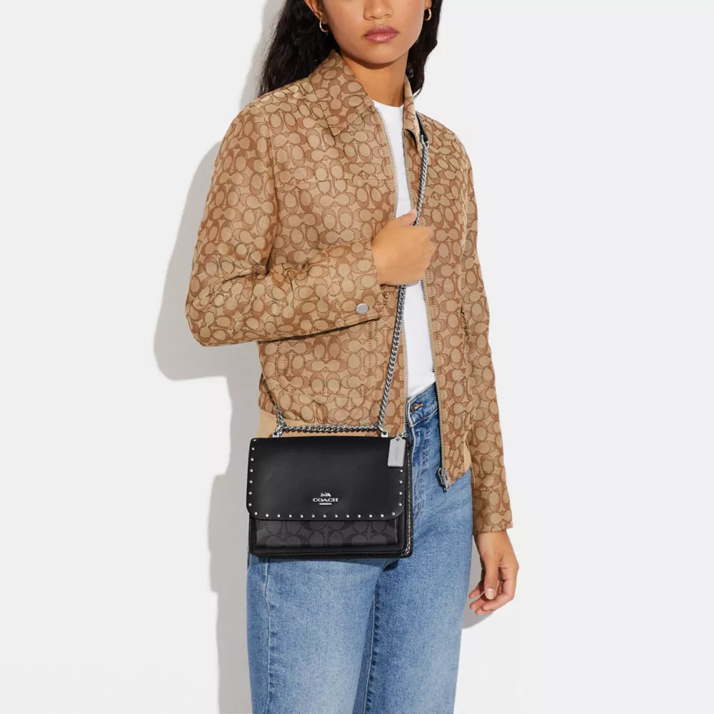 Klare Crossbody Bag In Signature Canvas With Rivets