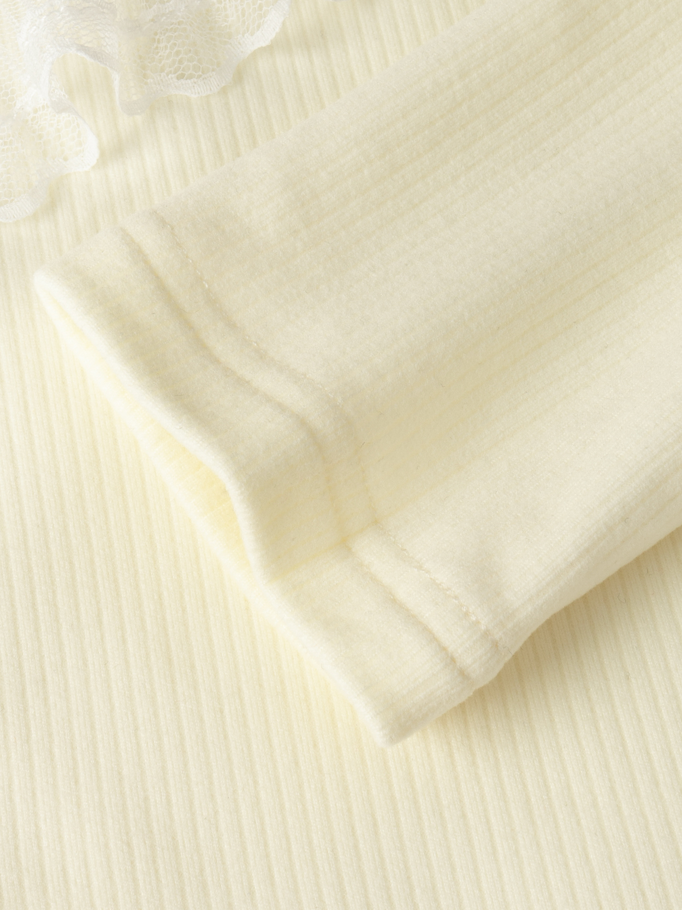 Women's Cream V-Neck Long Sleeve Top with Asymmetric Ruffle Lace Trim and Ribbed Detail