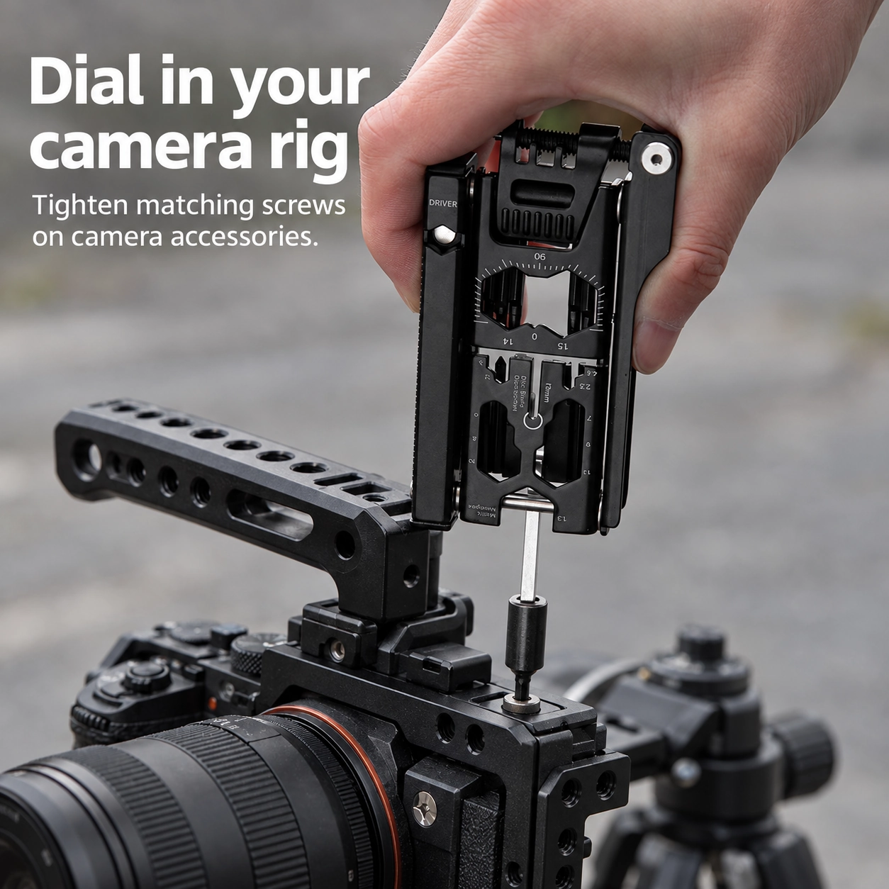 Black bike multitool tightening a top-facing mounting screw on a camera cage