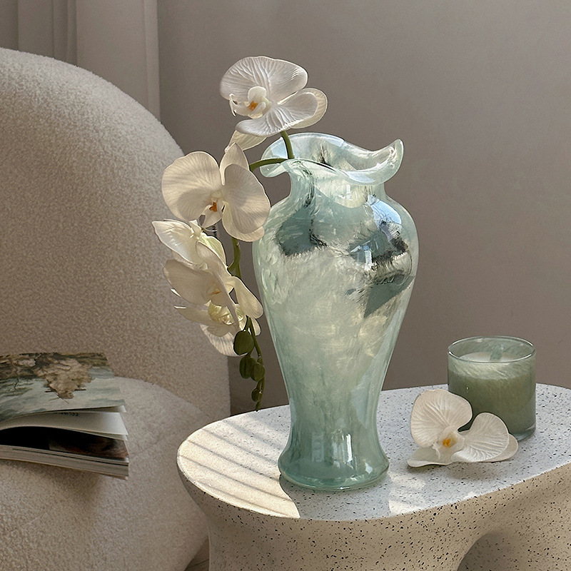 Transparent glass vase with blue patterns