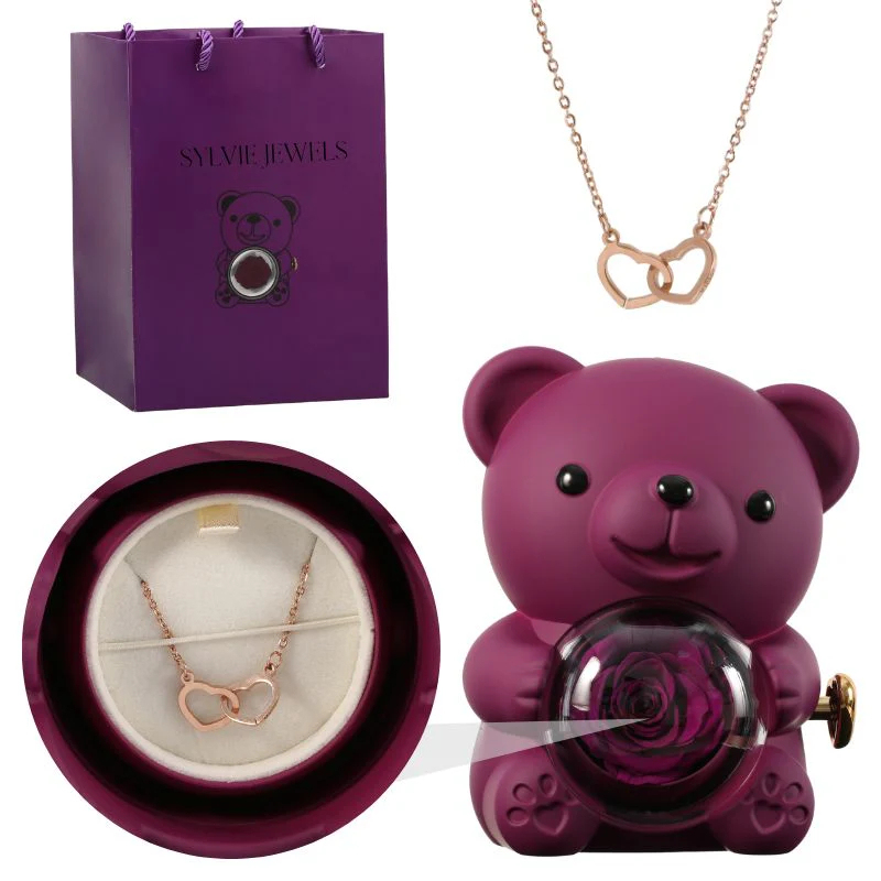 Eternal pink teddy bear with a necklace