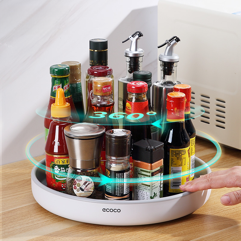 Rotating condiment storage rack for kitchen countertop, multi-functional storage tray for home use