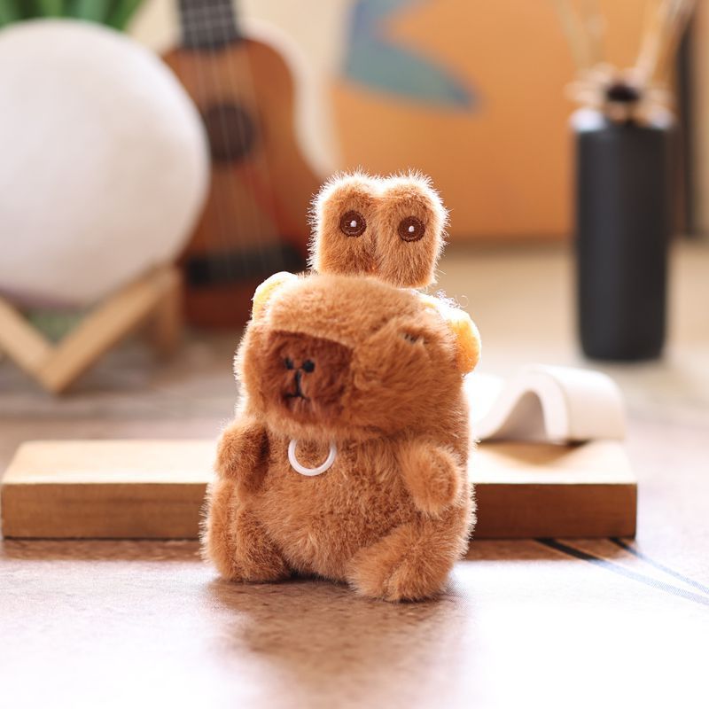 Cute and adorable capybara pendant plush toy with pullable moving rabbit ears, a backpack accessory