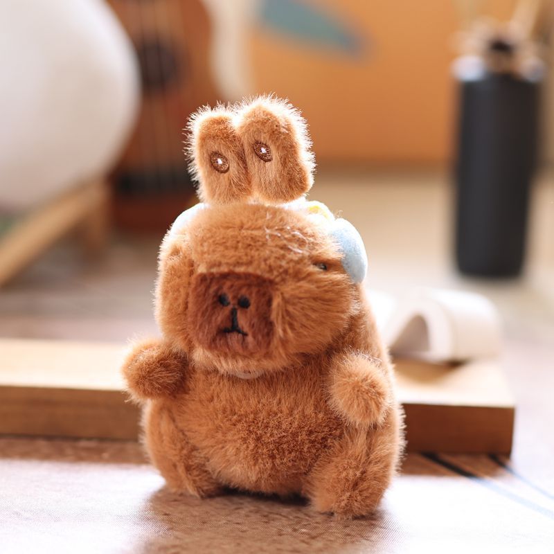 Cute and adorable capybara pendant plush toy with pullable moving rabbit ears, a backpack accessory