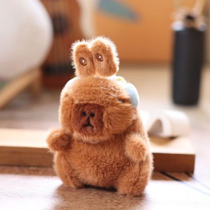 Cute and adorable capybara pendant plush toy with pullable moving rabbit ears, a backpack accessory