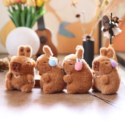 Cute and adorable capybara pendant plush toy with pullable moving rabbit ears, a backpack accessory