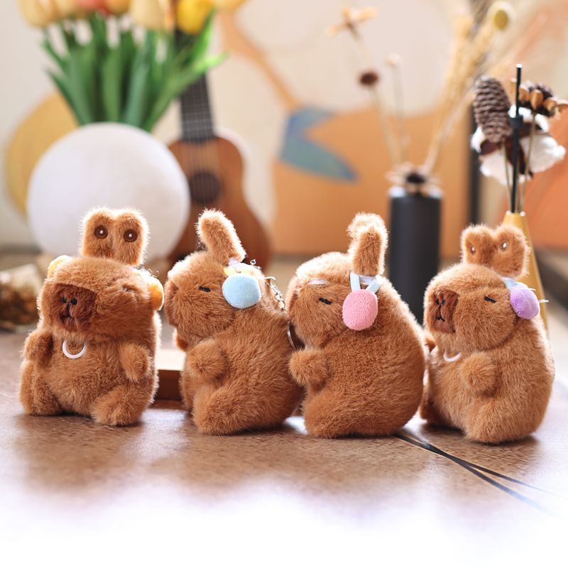 Cute and adorable capybara pendant plush toy with pullable moving rabbit ears, a backpack accessory