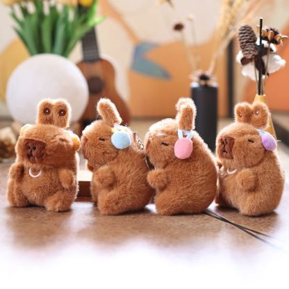 Cute and adorable capybara pendant plush toy with pullable moving rabbit ears, a backpack accessory