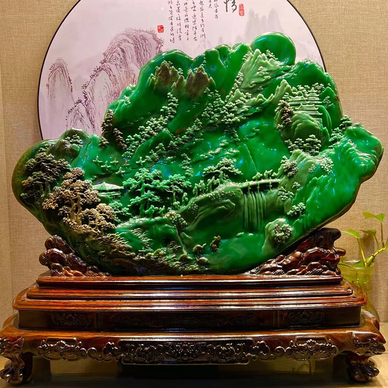 Hand-carved ornament of emerald green rural scenery