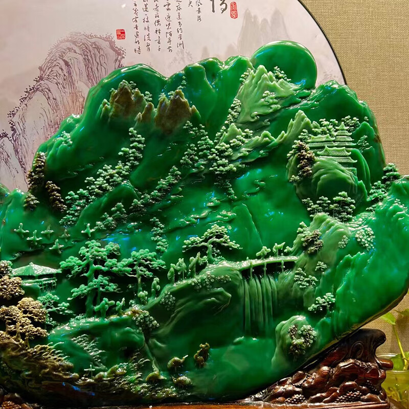 Hand-carved ornament of emerald green rural scenery