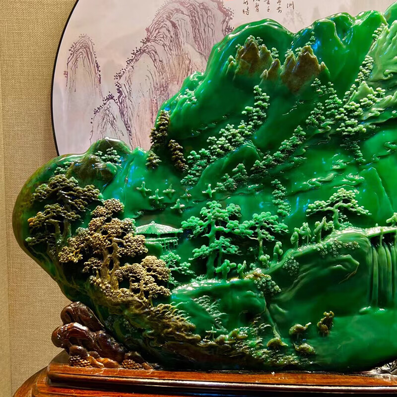 Hand-carved ornament of emerald green rural scenery