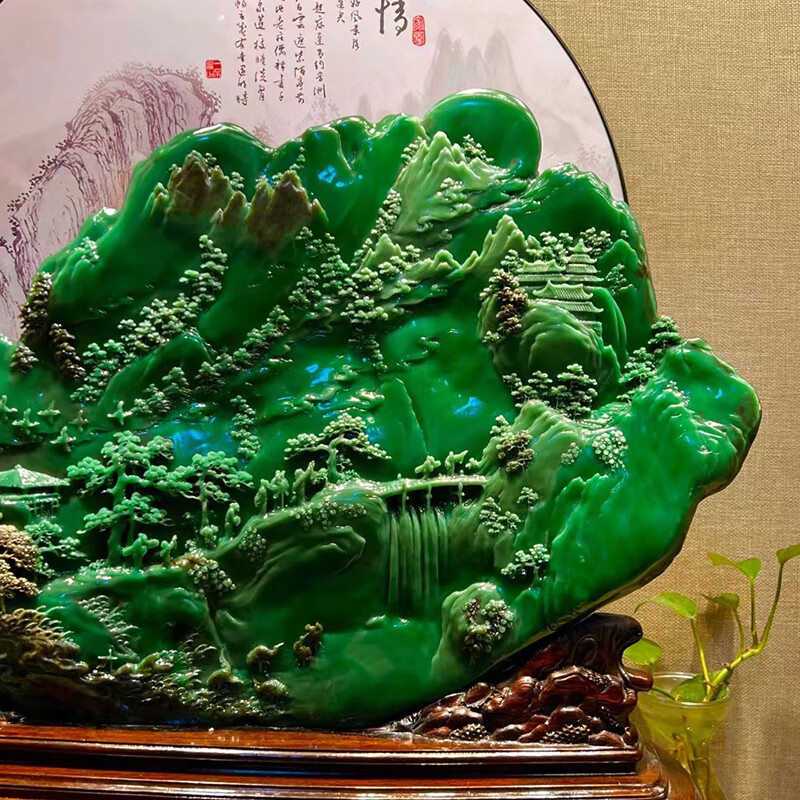 Hand-carved ornament of emerald green rural scenery