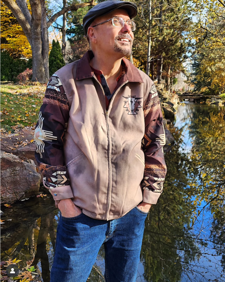 Retro brown jacket with a Southwestern-style pattern and a bull skull emblem