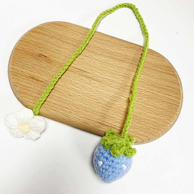 Hand-crocheted strawberry and sunflower pendant
