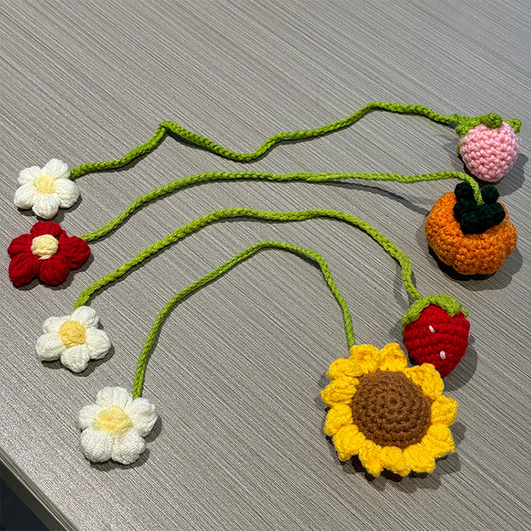Hand-crocheted strawberry and sunflower pendant