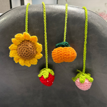 Hand-crocheted strawberry and sunflower pendant