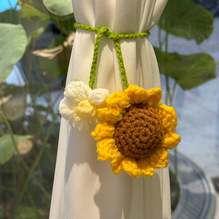 Hand-crocheted strawberry and sunflower pendant