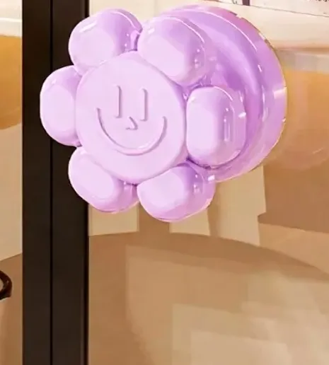 Flower suction cup door handle attached to glass door