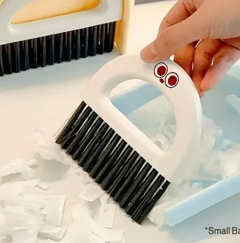Portable dustpan and brush for workspace tidiness