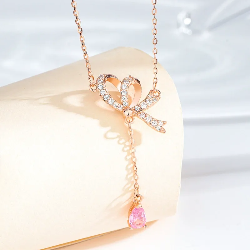 INS3272-SWAROVSKI Volta Necklace, Earrings, and Bracelets Jewelry Collection, Bow-Inspired Pink and Clear Crystals with Rose-Gold Tone Finish
