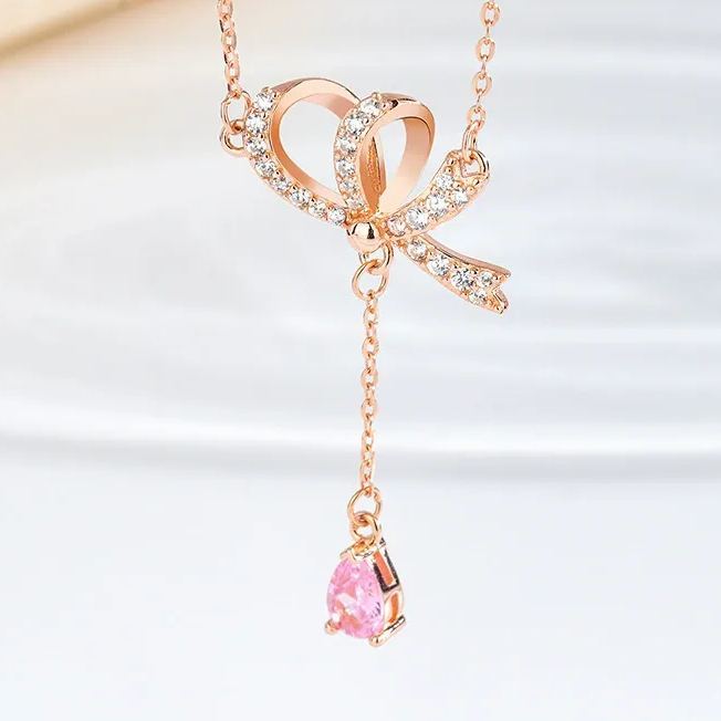 INS3272-SWAROVSKI Volta Necklace, Earrings, and Bracelets Jewelry Collection, Bow-Inspired Pink and Clear Crystals with Rose-Gold Tone Finish