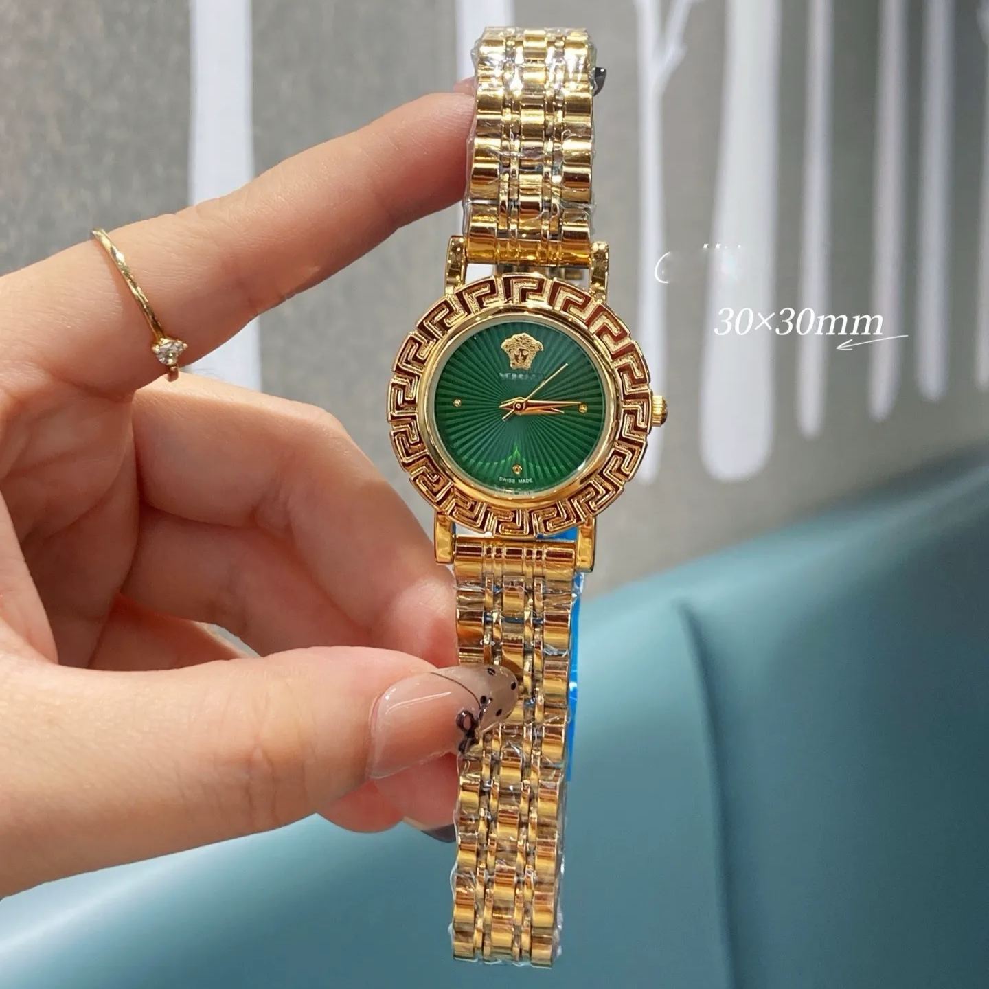 W-2041-Versace Versace Reve Collection Luxury Womens Watch Timepieces with a Gold Bracelet and Case featuring a Black Dial