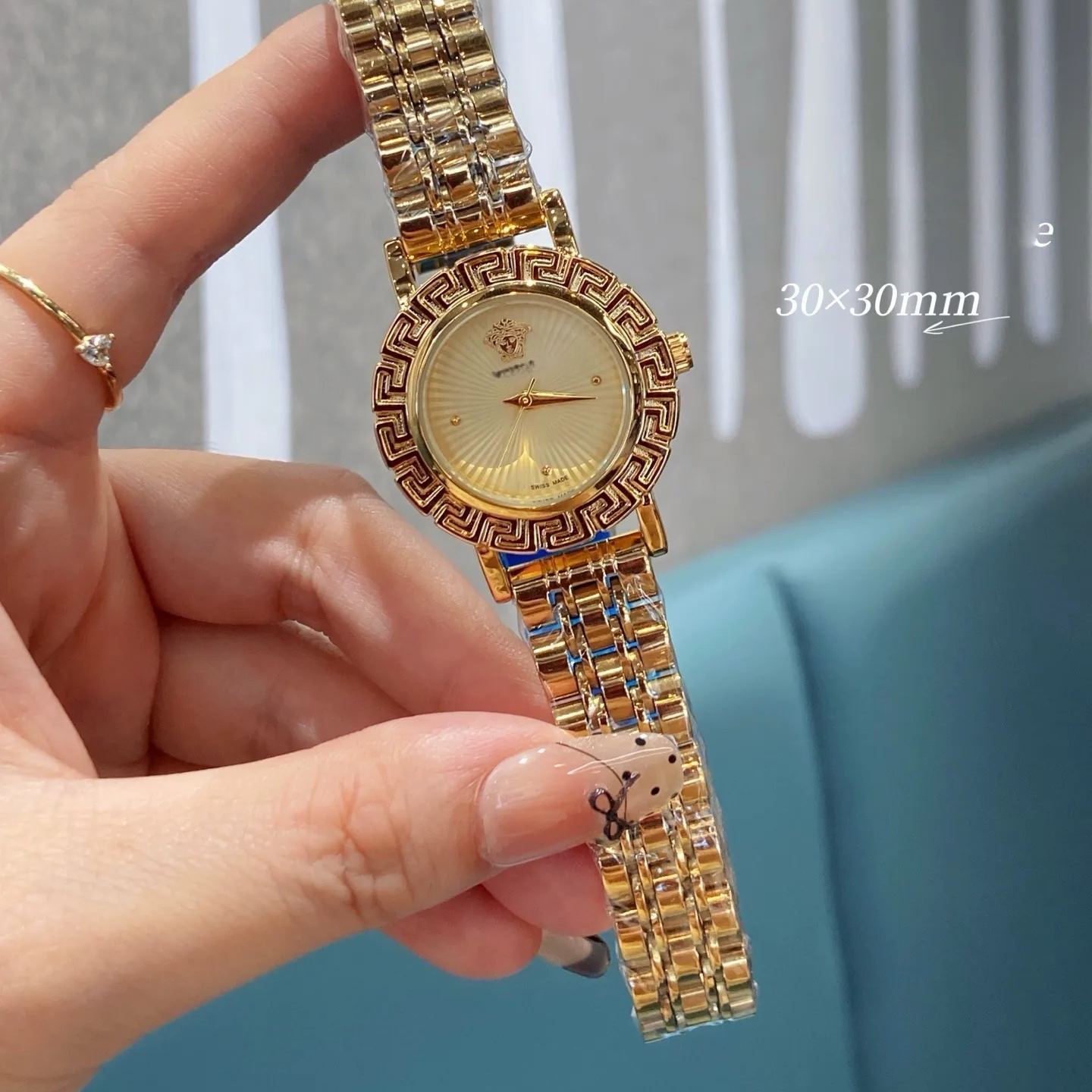 W-2041-Versace Versace Reve Collection Luxury Womens Watch Timepieces with a Gold Bracelet and Case featuring a Black Dial