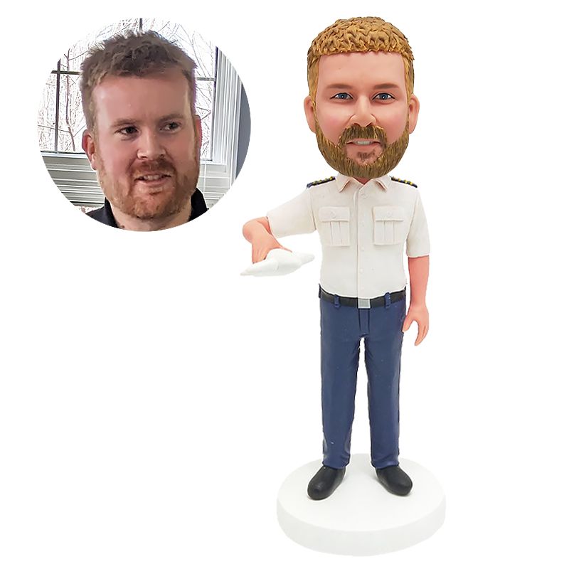 custom bobblehead figure pilot holding a plane model
