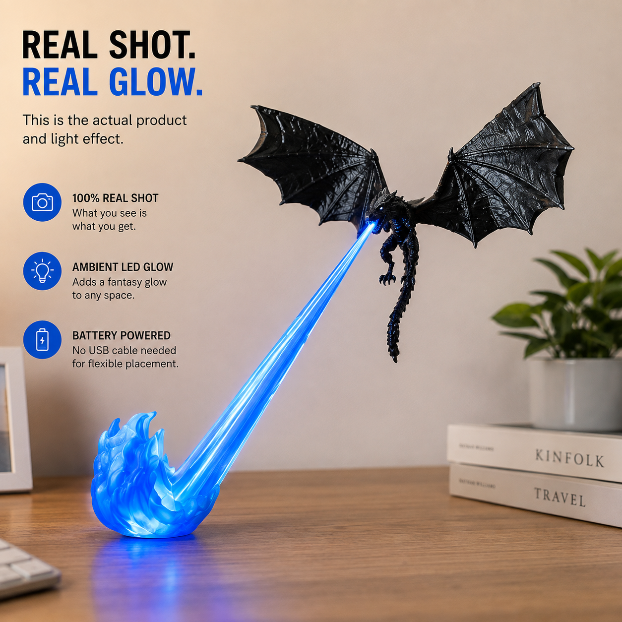 Black flying dragon display with glowing blue flame beam on a desk