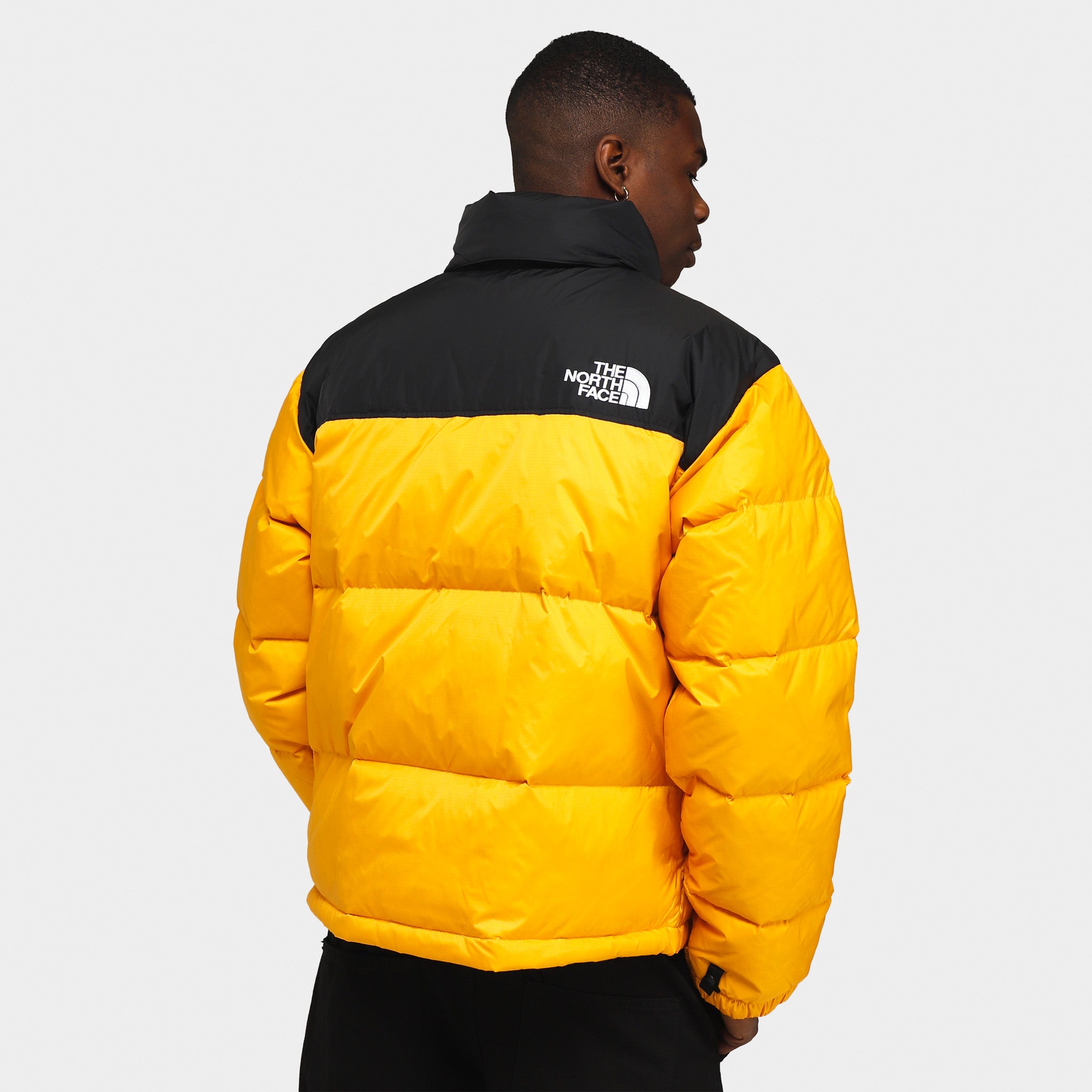 The Nothtrth Fathtce 1996 Retro Nuptse Jacket Summit Gold / TNF Black