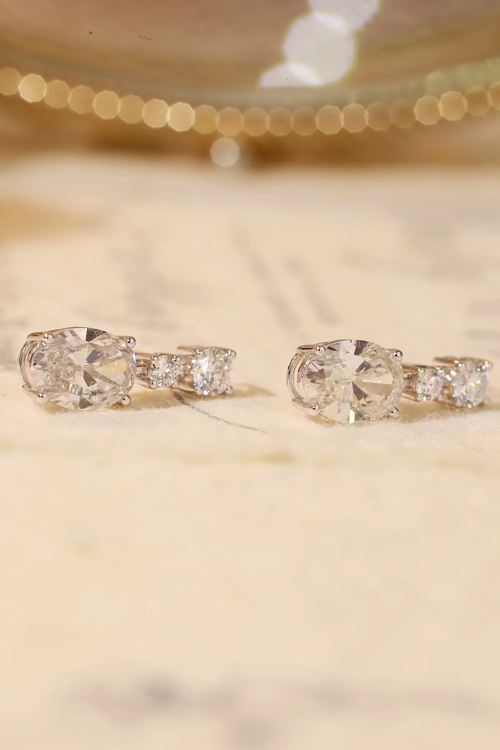 10K gold carat oval diamond earrings with four-prong setting