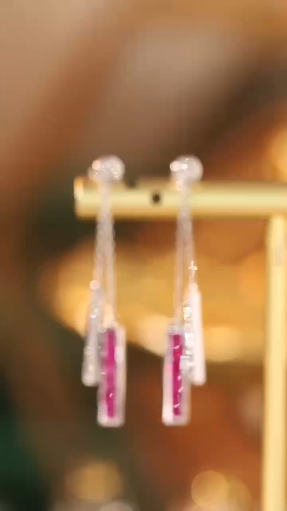 18k gold heart-shaped earrings featuring a 1.00-carat natural ruby and a 0.20-carat natural diamond, set using a bezel setting technique.Mystery Setting