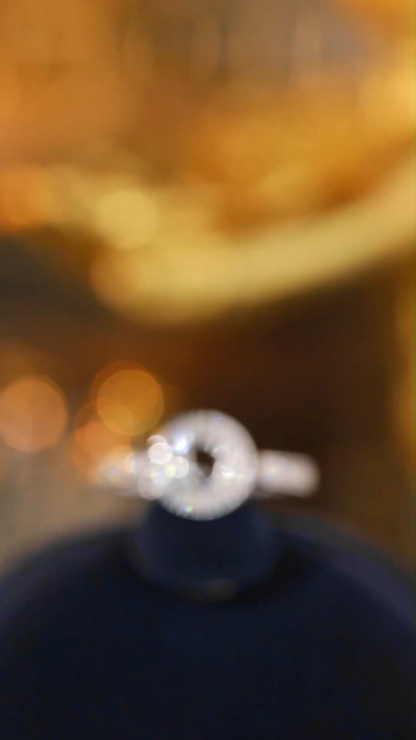 18k gold ring set with a natural diamond; the diamond features a Tapered Baguette cut and weighs 0.40 carats.