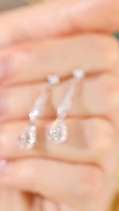 10k Gold Diamond Earrings: Droplet-cut 2.30ct Cultured Diamond, set in a three-prong design for an elegant look