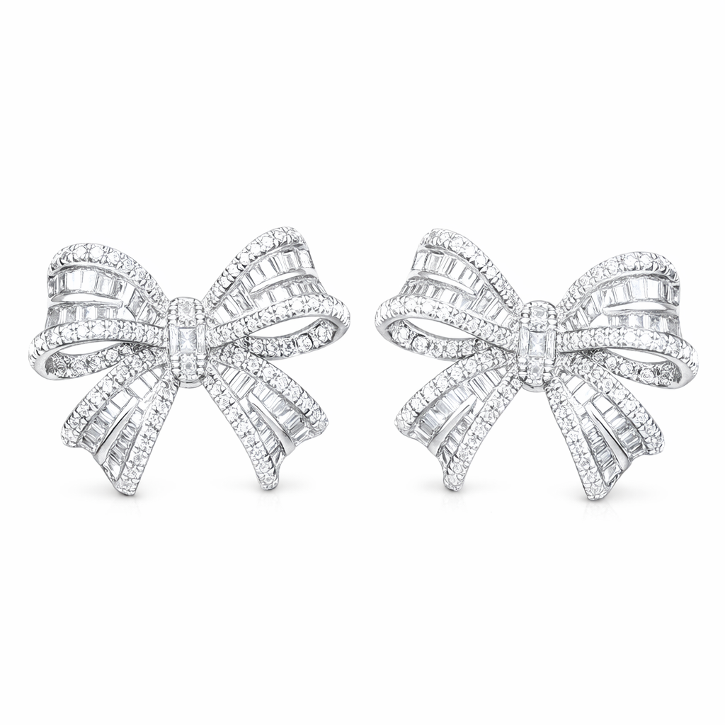 18-karat gold earrings in the shape of a butterfly, featuring a natural diamond of 1.00 carats set in a tapered baguette cut within a channel setting.