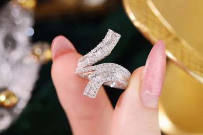 18k gold ring set with a natural diamond; the diamond features a Tapered Baguette cut and weighs 0.72carats.