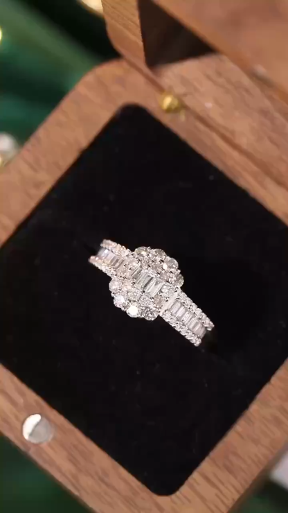 18k gold ring set with a natural diamond; the diamond features a Tapered Baguette cut and weighs 1.00 carats.