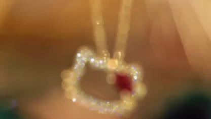 Hello Kitty 18k gold necklace gourd shape four claws inlaid with oval ruby 0.55ct accessory stone 0.18ct.