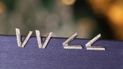 18k gold earring stud with the letter “V” and a 0.08ct natural diamond inlaid.