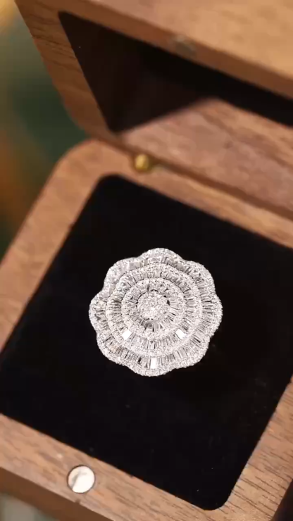 18k gold ring set with a natural diamond; the diamond features a Tapered Baguette cut and weighs 1.50carats.