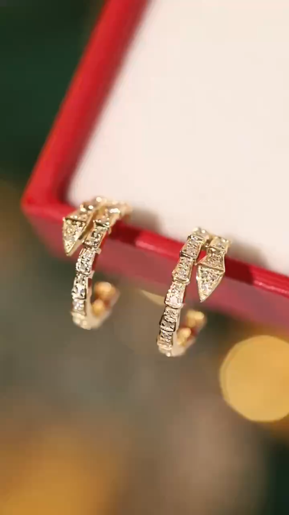 snake 18k gold earrings set with 0.26-carat natural diamond