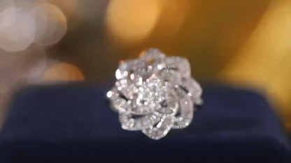 18k gold ring set with a natural diamond; the diamond features a Tapered Baguette cut and weighs 0.65carats.