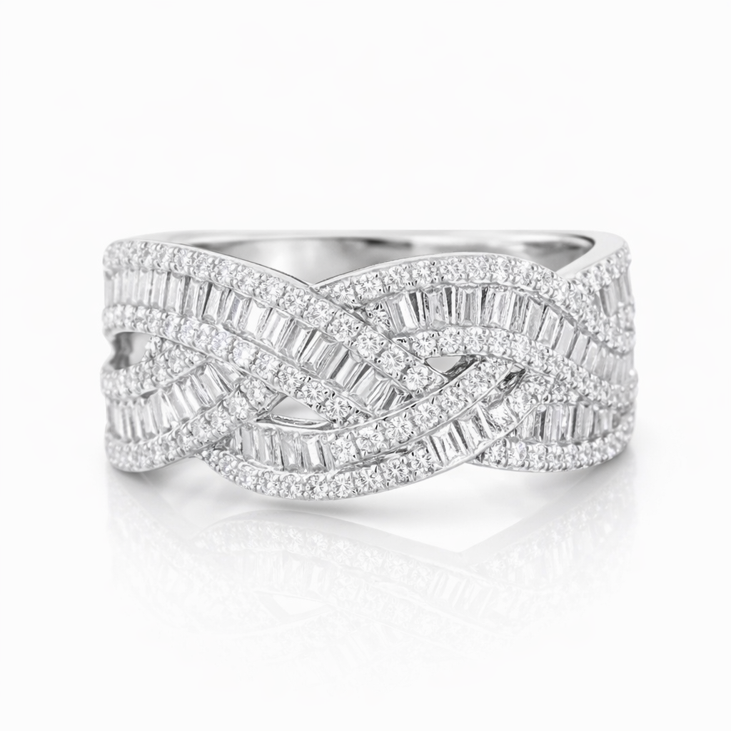 18k gold ring set with a natural diamond; the diamond features a Tapered Baguette cut and weighs 0.65carats.