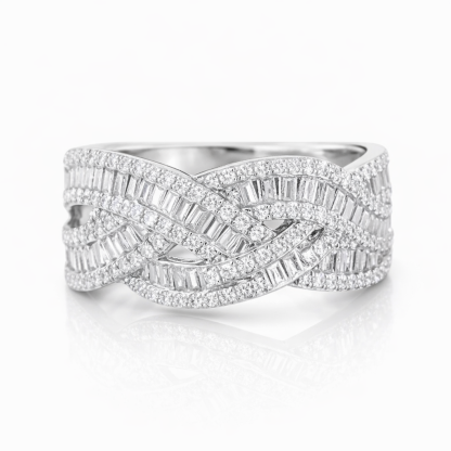 18k gold ring set with a natural diamond; the diamond features a Tapered Baguette cut and weighs 0.65carats.