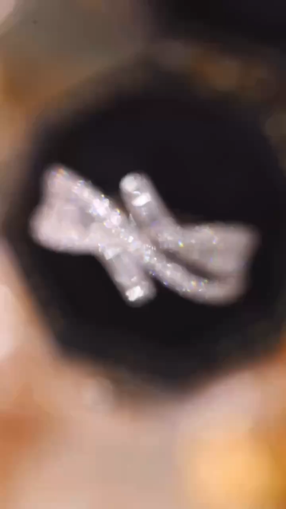 18k gold ring set with a natural diamond; the diamond features a Tapered Baguette cut and weighs 0.60 carats.