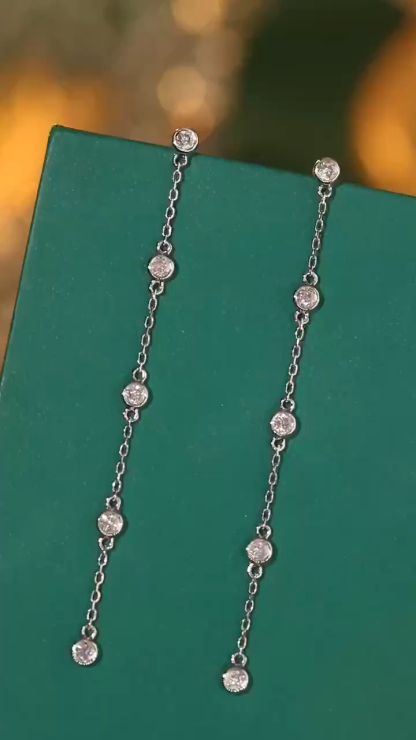 18k gold earrings with bezel setting, featuring a 0.30ct natural diamond.