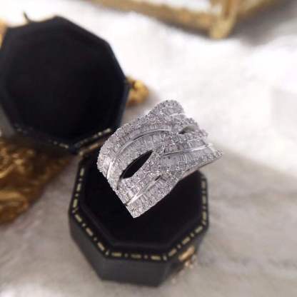 18k gold ring set with a natural diamond; the diamond features a Tapered Baguette cut and weighs 1.45carats.