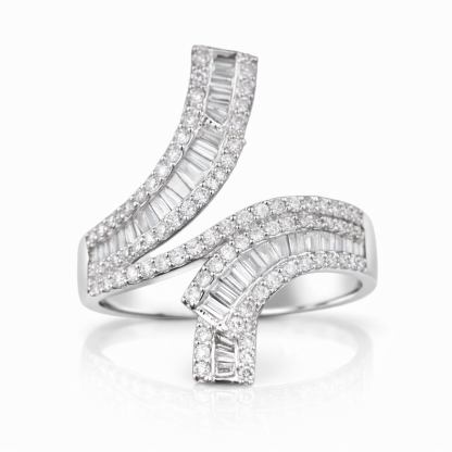 18k gold ring set with a natural diamond; the diamond features a Tapered Baguette cut and weighs 0.72carats.