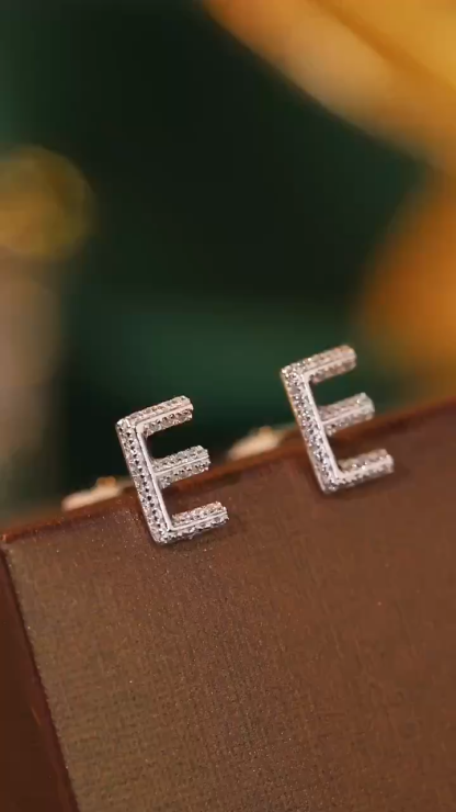 18k gold earring stud with the letter “E” and a 0.10ct natural diamond inlaid.